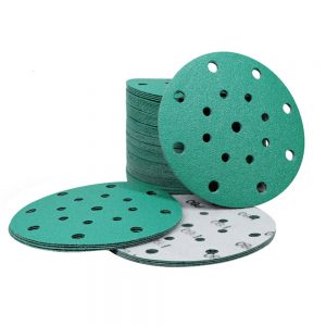 A pack of green velcro sanding discs with holes, designed for efficient sanding and dust extraction.