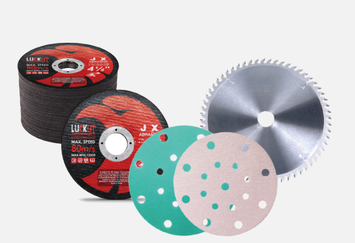 A collection of various grinding wheels and discs arranged for display, showcasing different shapes and sizes.